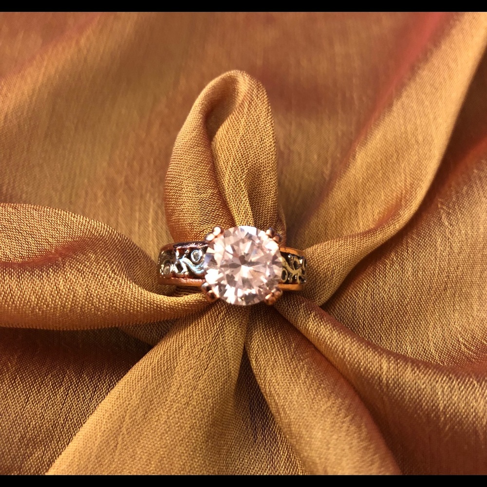 Womens white and rose gold ring.